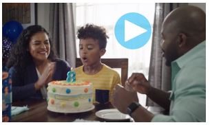 Family celebrating child's birthday